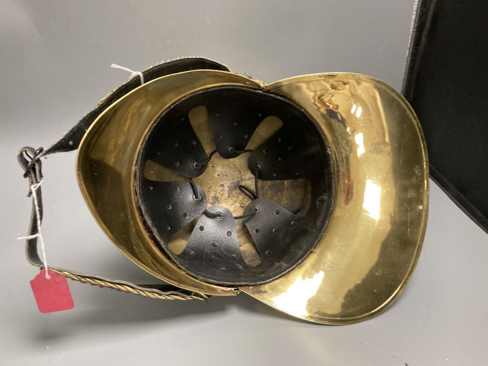 A reproduction brass firemans helmet, height 27cm